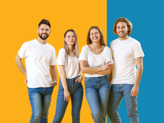 Bubba101 - Group of four young people standing in front of a yellow and blue background.